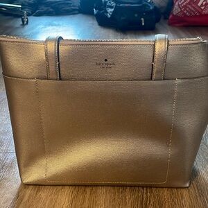 Gold Kate Spade purse and wallet